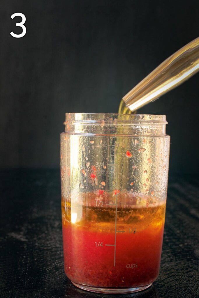 adding oil to the dressing cruet.