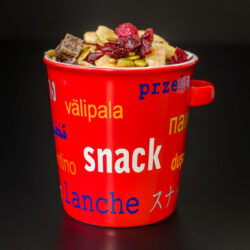 red snack bowl piled high with homemade nut-free trail mix.