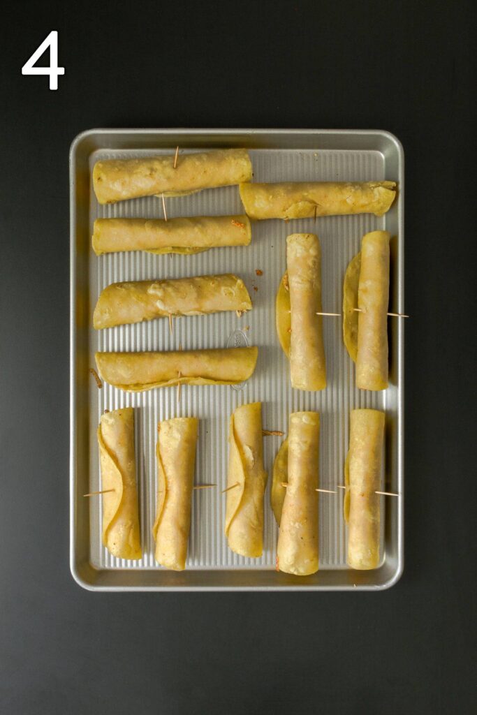 rolled flautas on baking sheet.