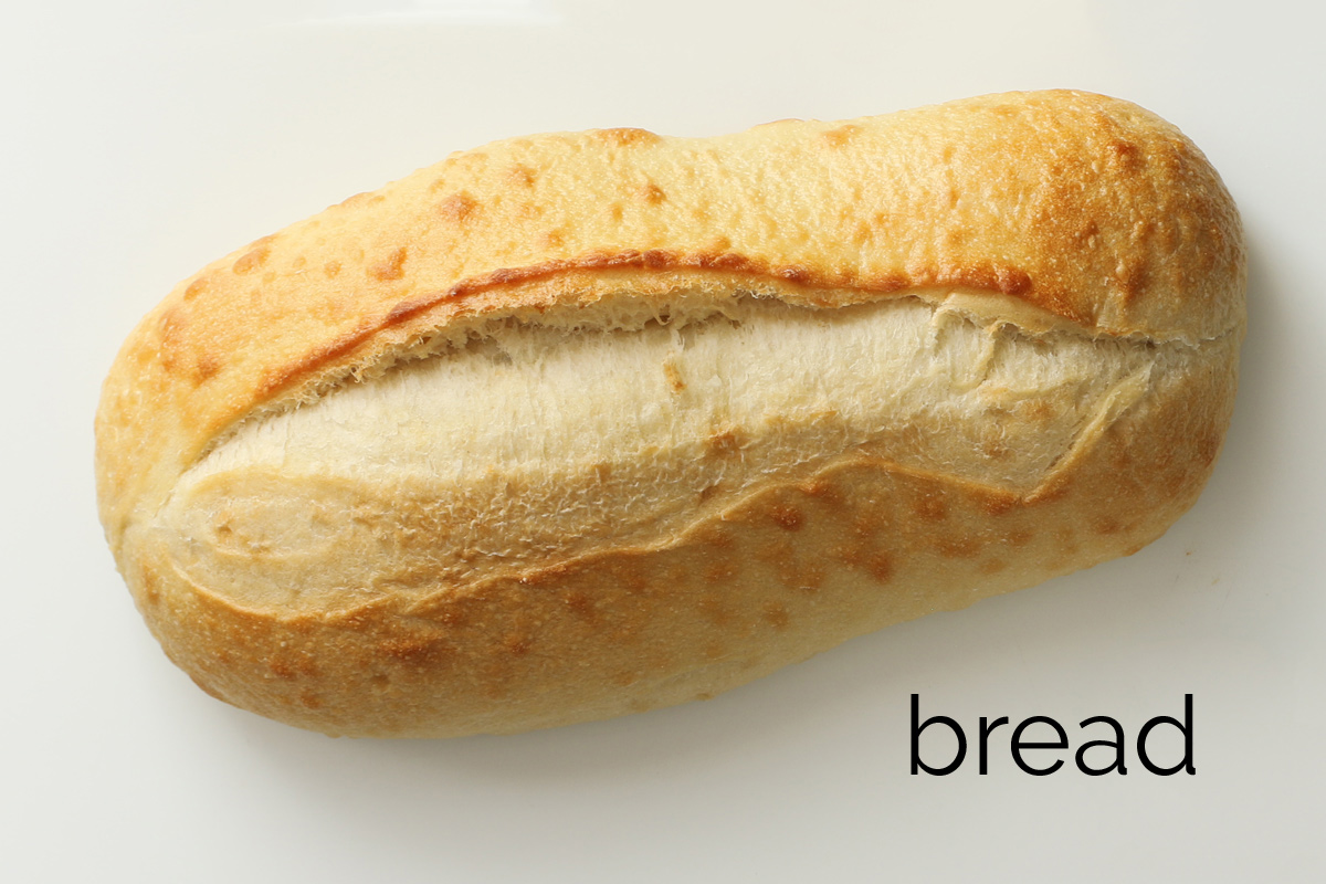 loaf of Italian bread on a white board.