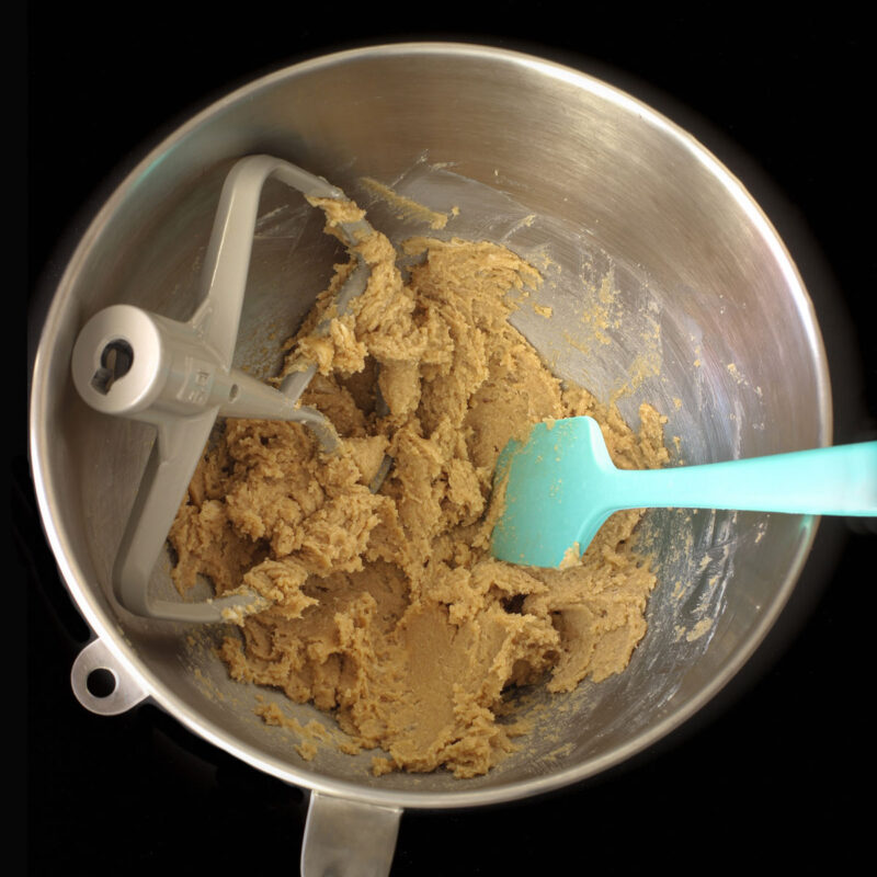 creamed butter and sugar in mixing bowl with spatula.