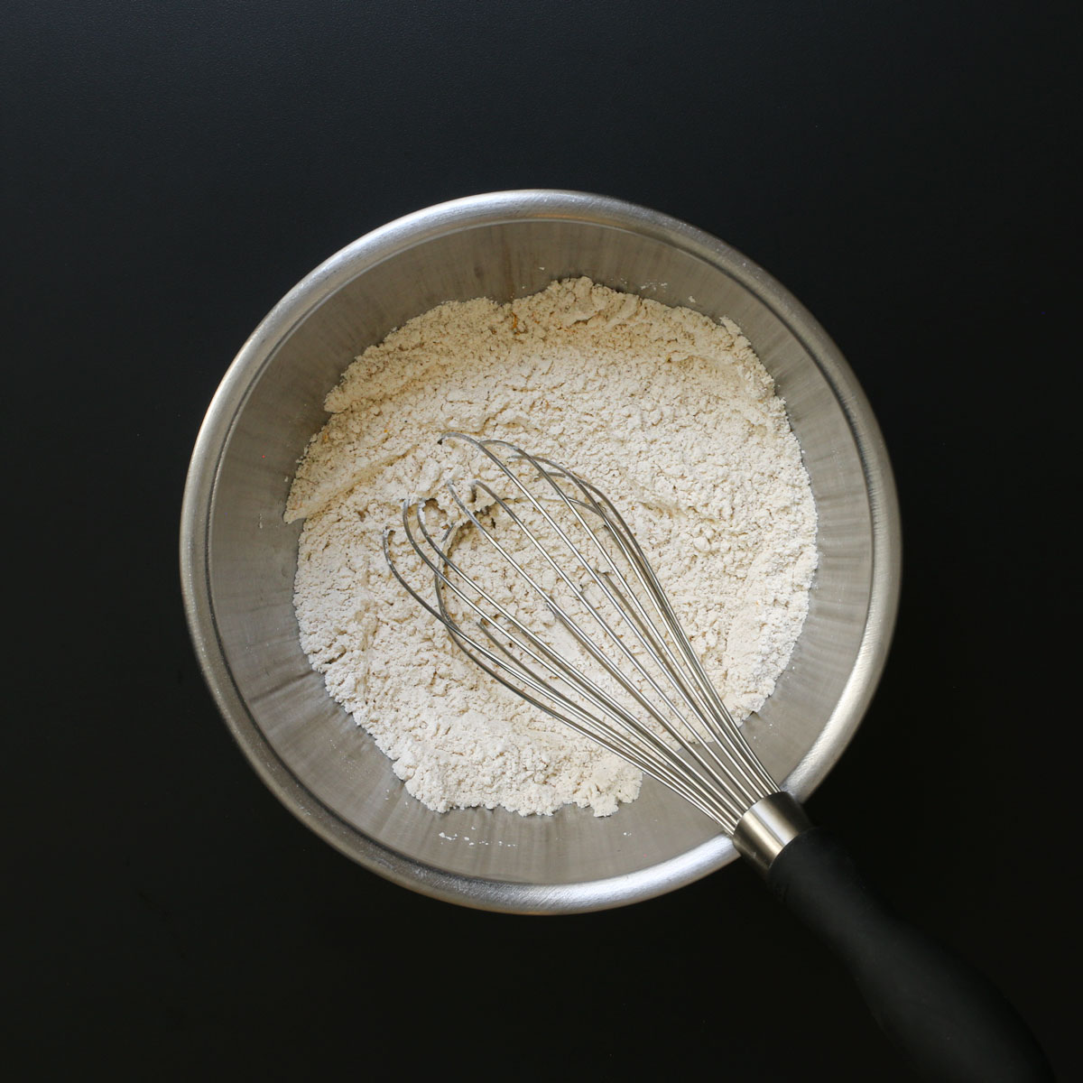 mixing bowl with dry ingredients and whisk.