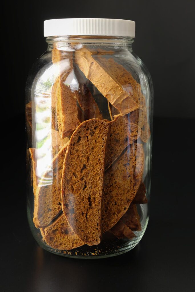 cooled biscotti stored in a large mason jar.