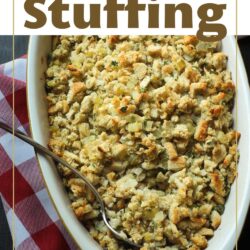 text overlay on picture of Baked stuffing in dish with spoon on red checked cloth.