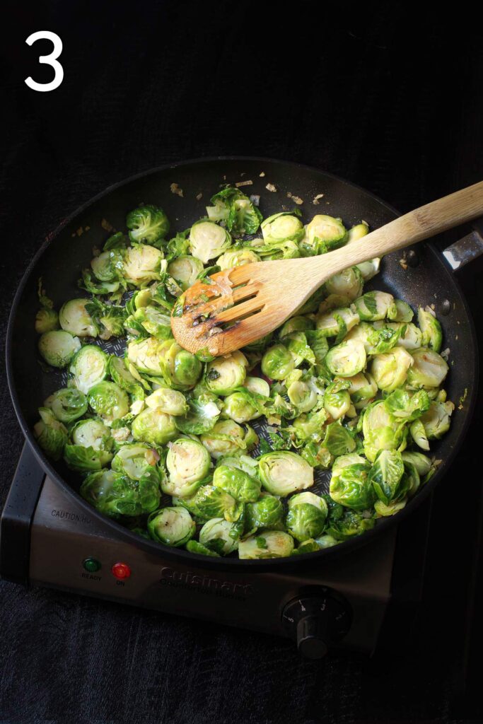 stirring the brussels sprouts into the mixture in the skillet.