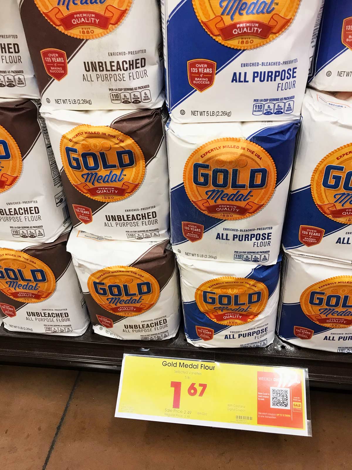 sale display of flour bags for $1.67 at the grocery store.