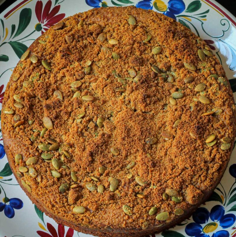 overhead close up shot of pumpkin coffee cake on a flowered platter.