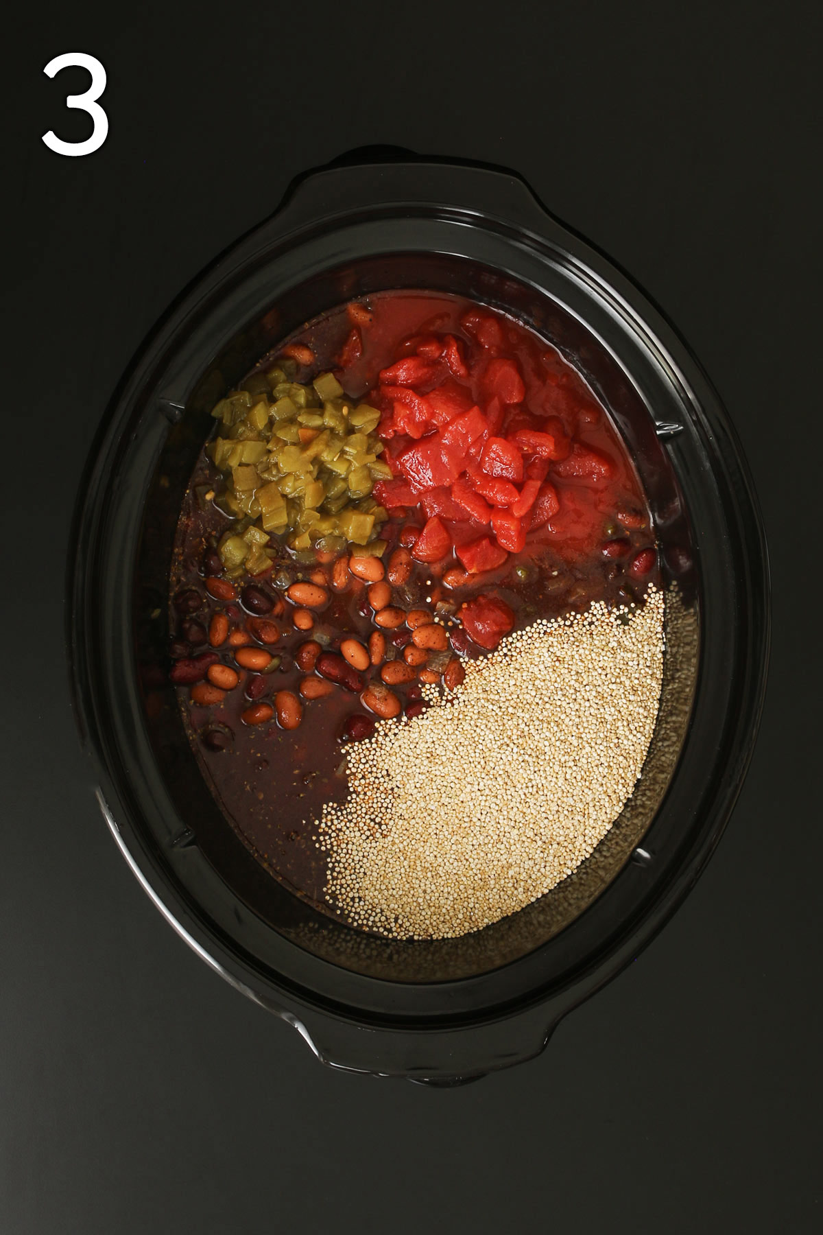 adding beans, quinoa, tomatoes, and chiles to crock pot.
