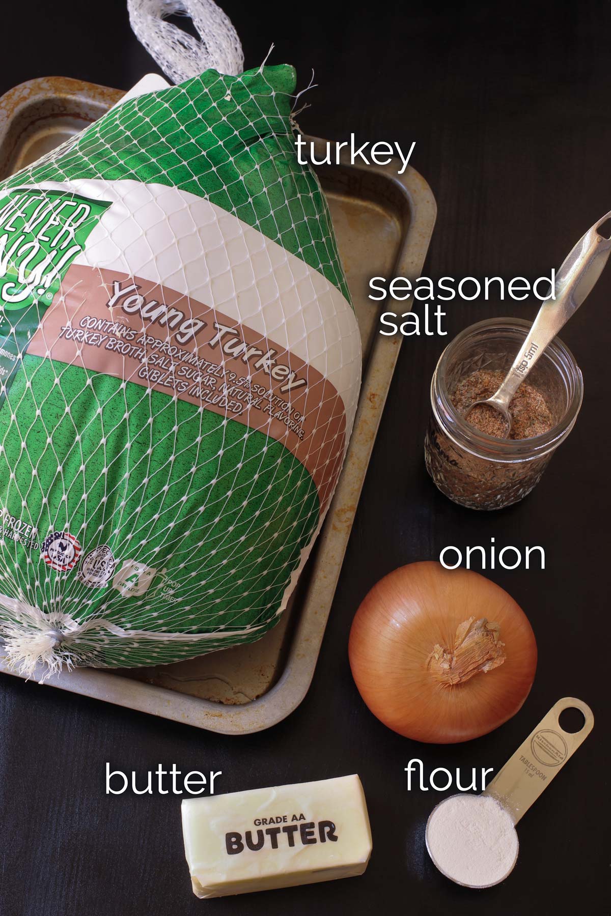 ingredients for whole roast turkey on table top.