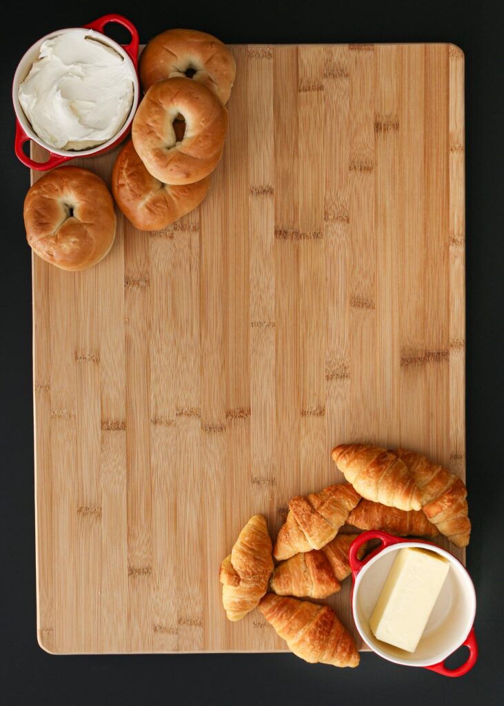 bagels and croissants added to the board.