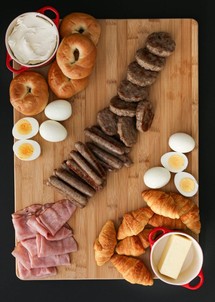 eggs, sausages, and ham added to the board.