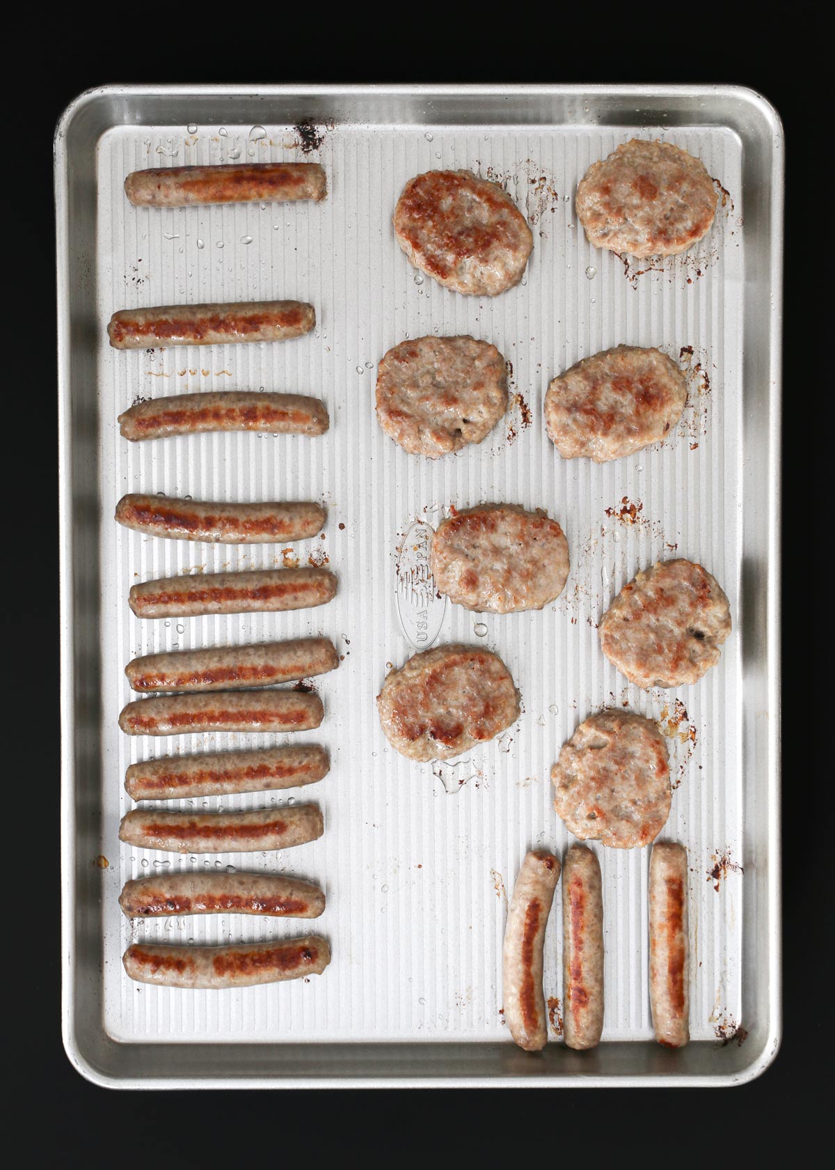 cooked sausage on the sheet pan.