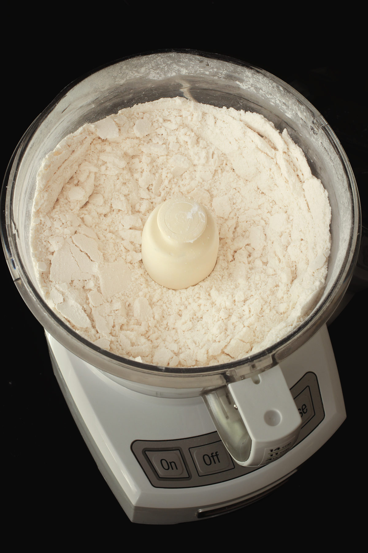 butter and flour crumbs in food processor bowl.