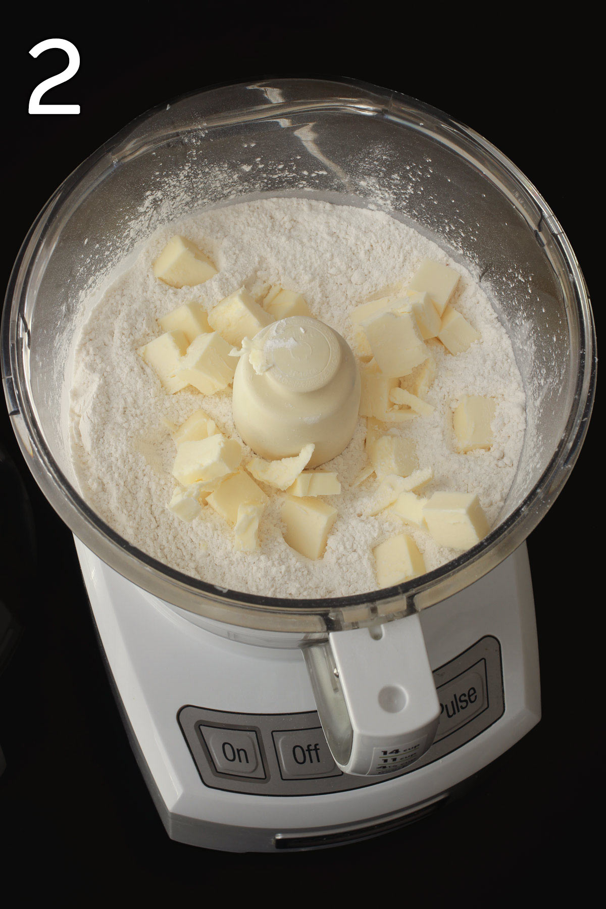 flour, butter and sugar in food processor bowl.