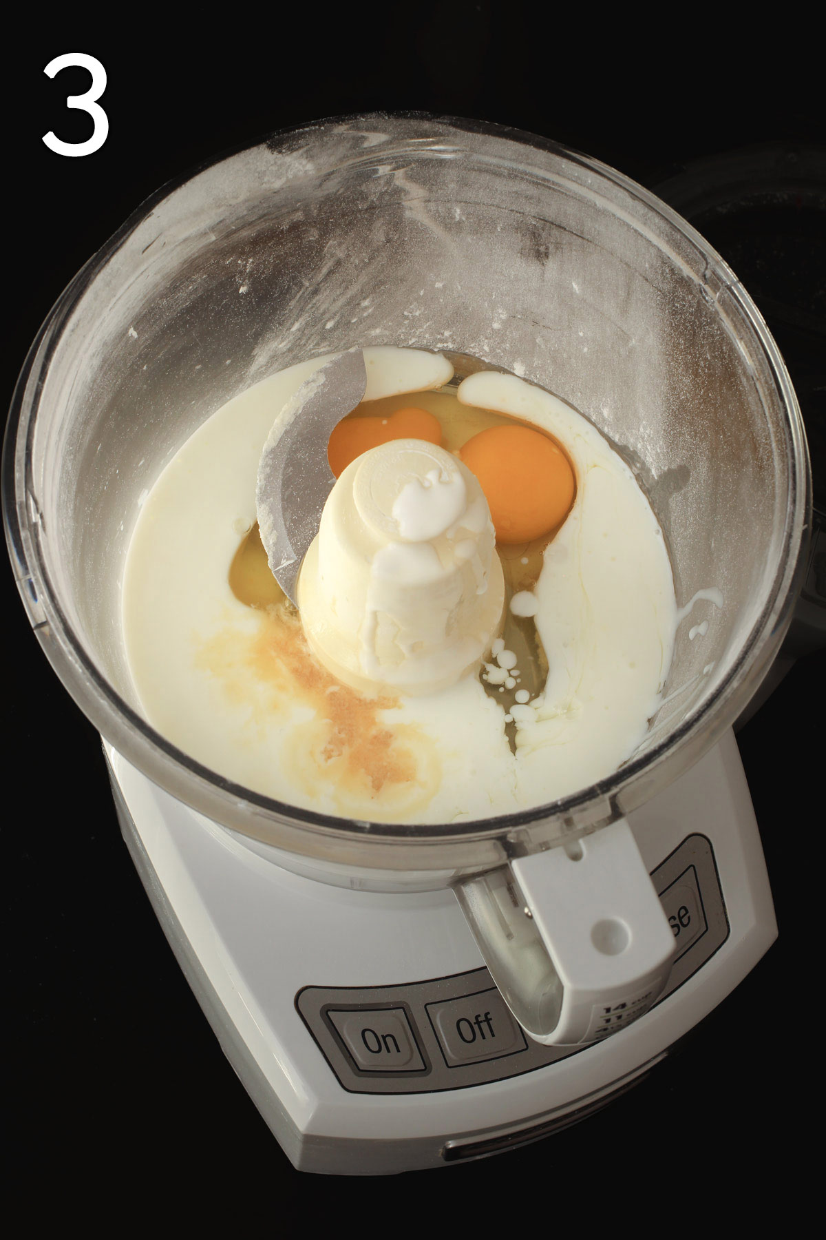 eggs, buttermilk, and vanilla extract in the food processor bowl.