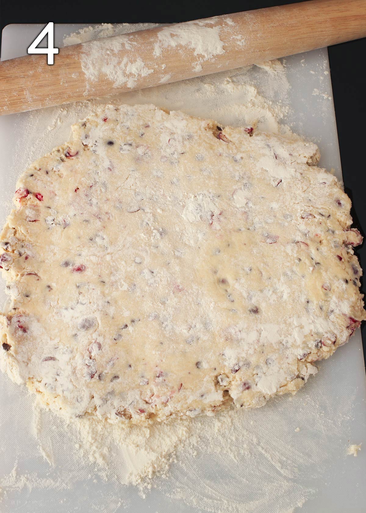 dough rolled out on a floured board.