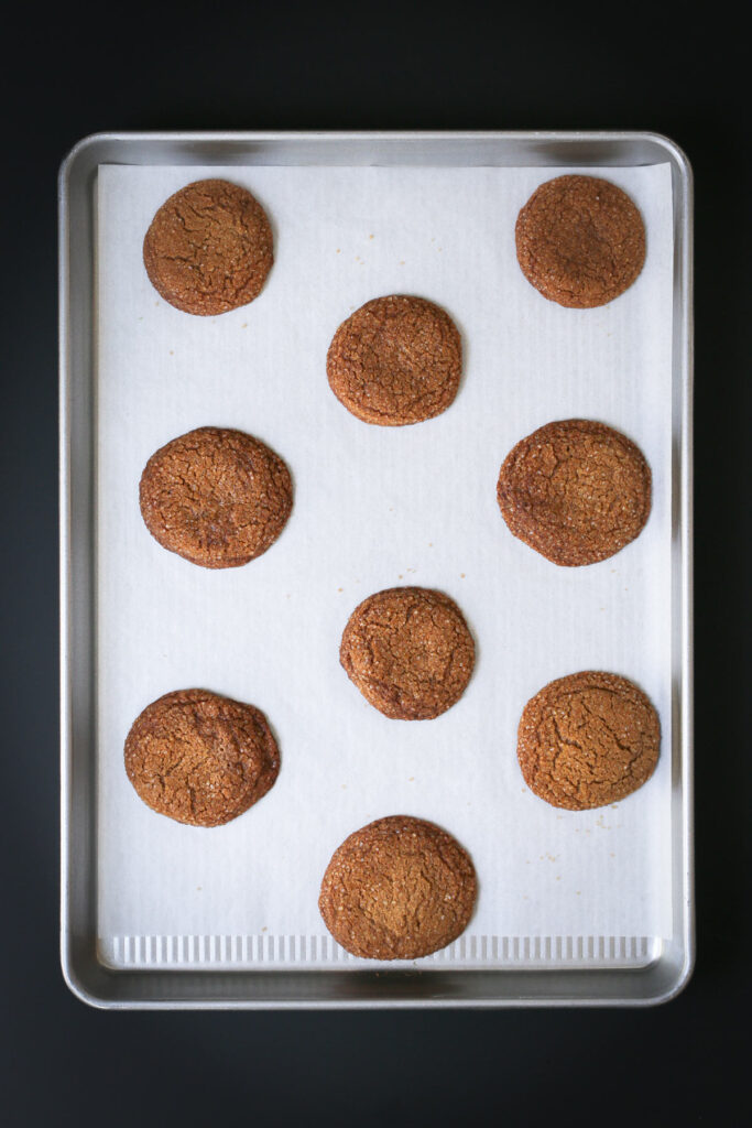 the baked molasses crinkles on cookie sheet.