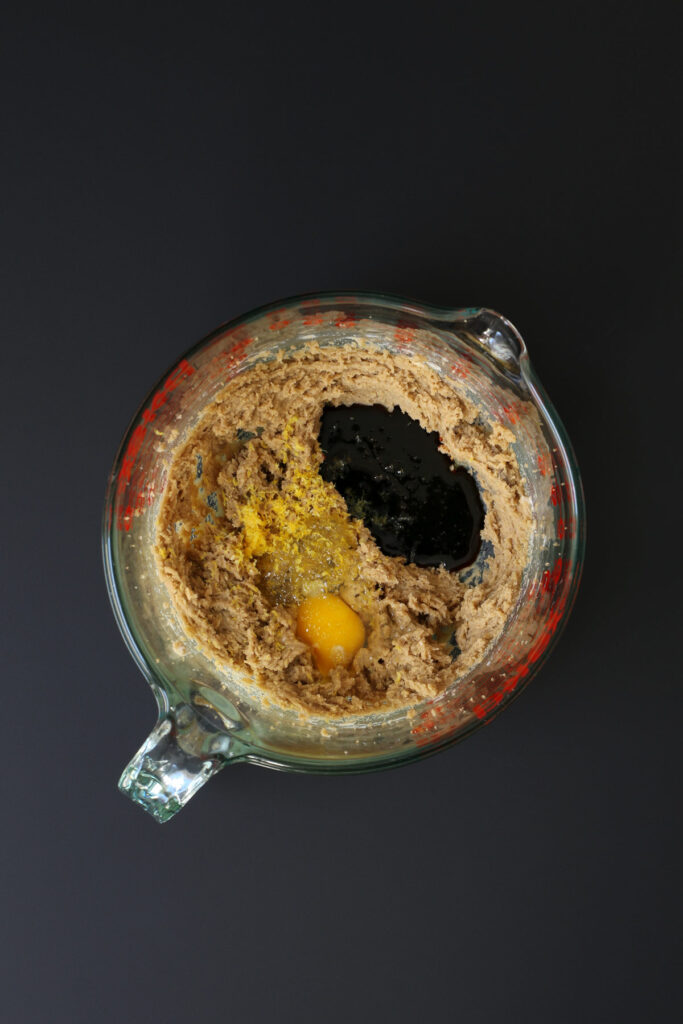 adding molasses and egg to creamed mixture.