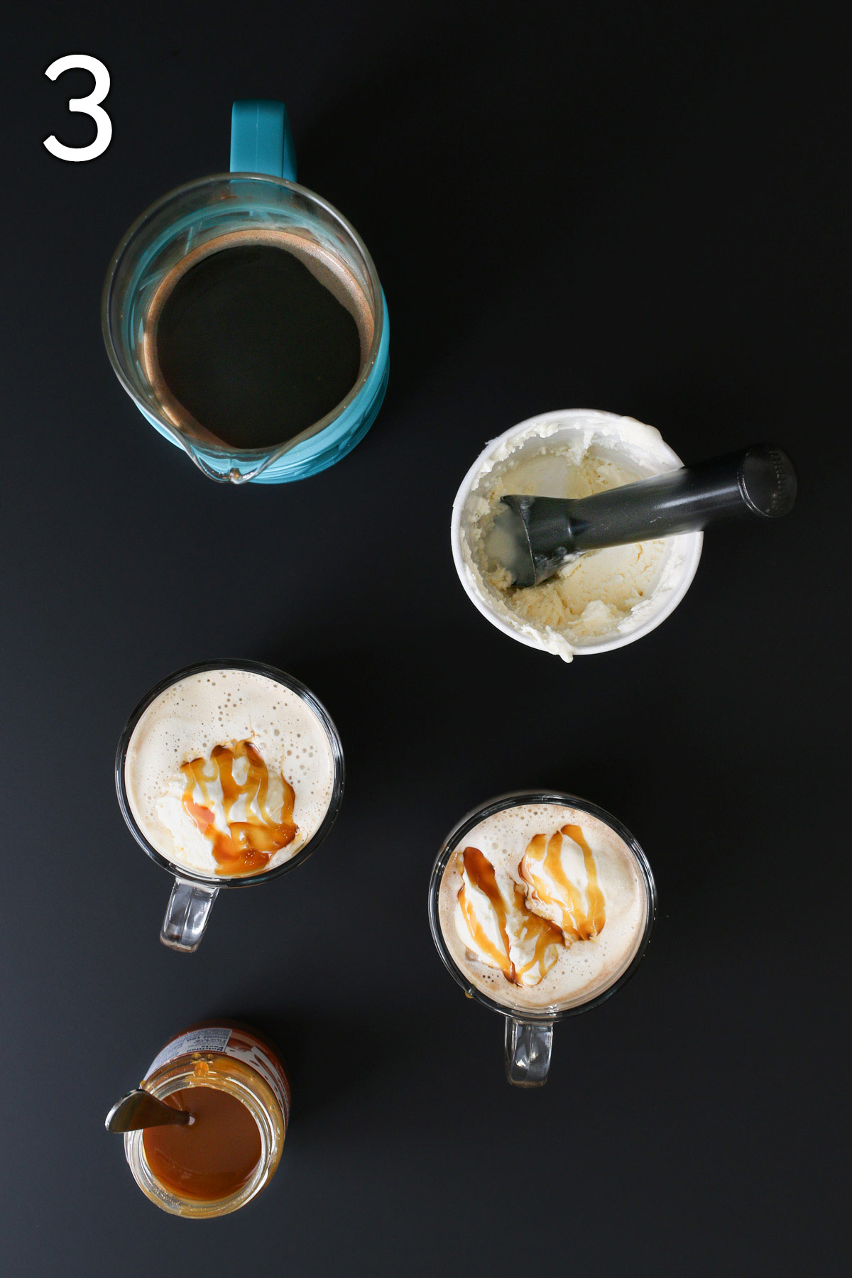 caramel is drizzled on the ice cream foam in the mugs, with a jar of caramel nearby.