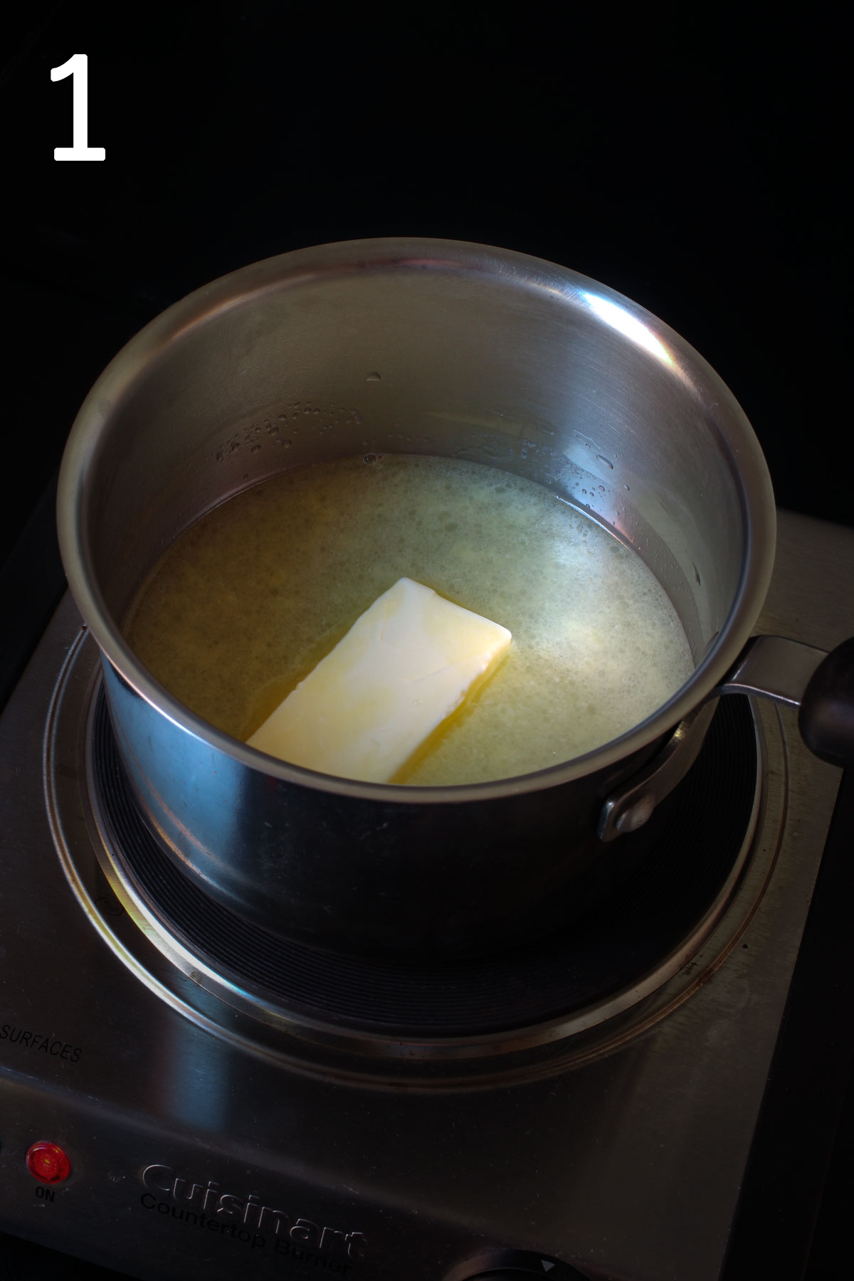 melting butter in saucepan on burner.