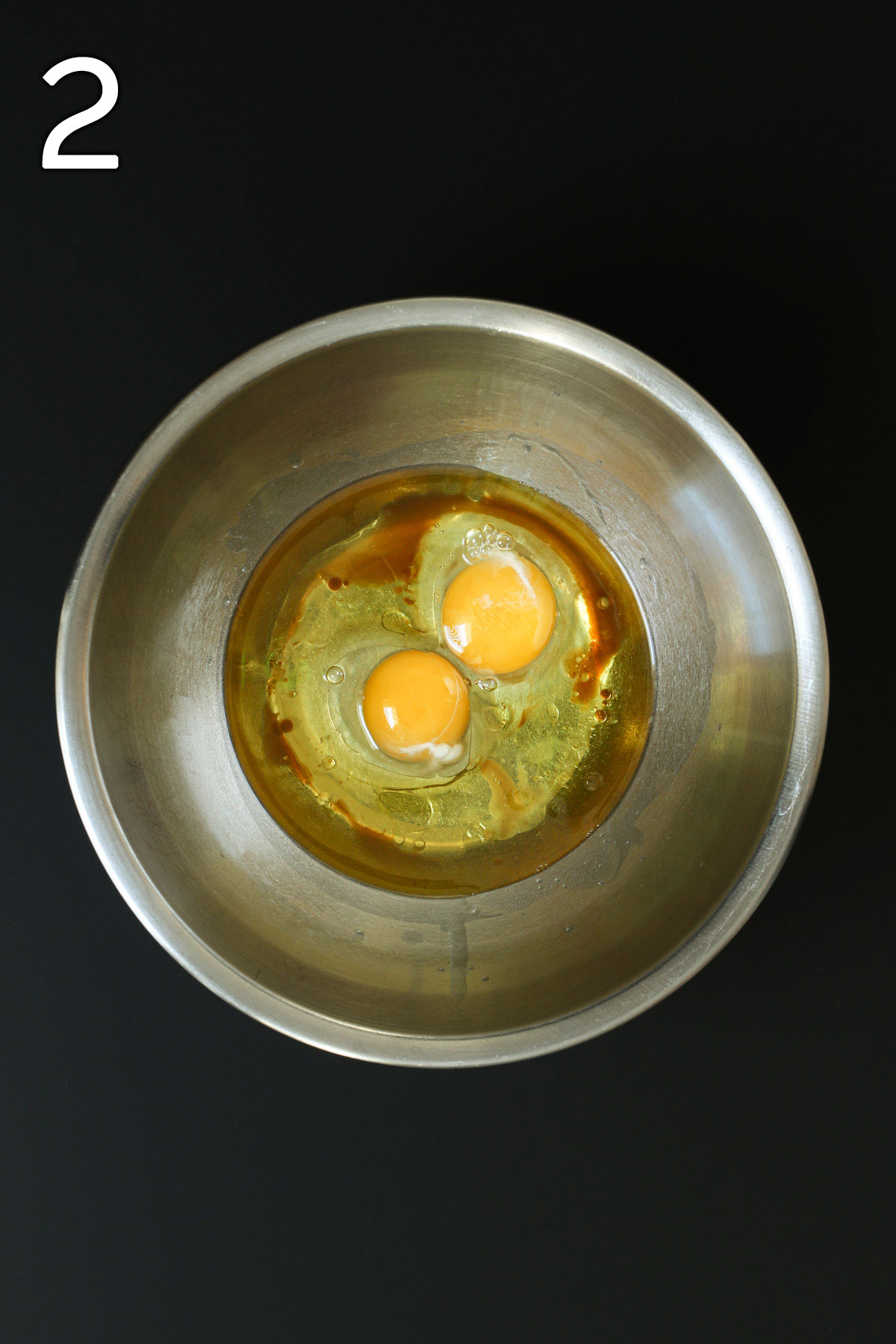 eggs, oil, and extracts in mixing bowl.