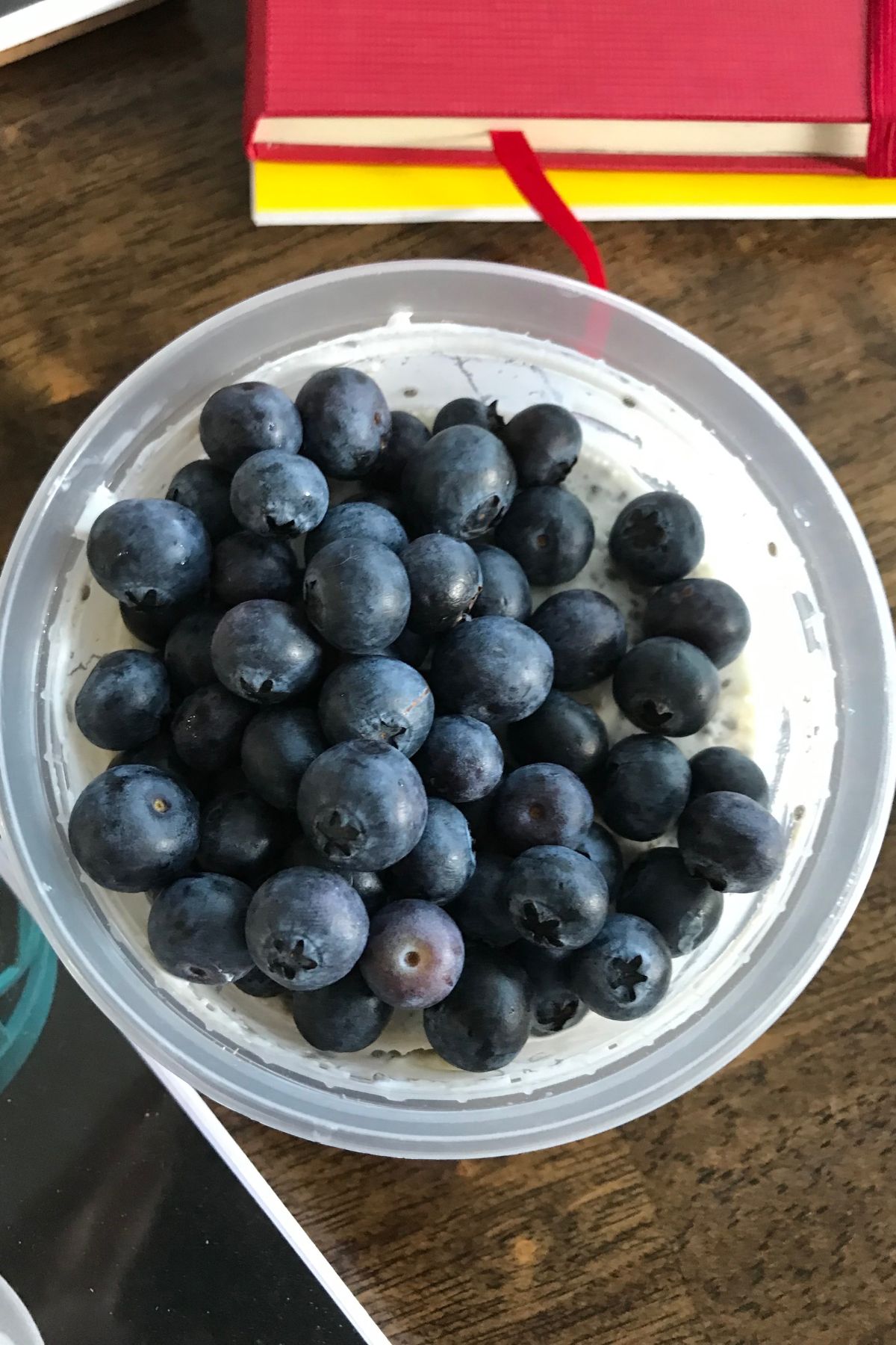 cup of overnight oats and blueberries, with text overlay.