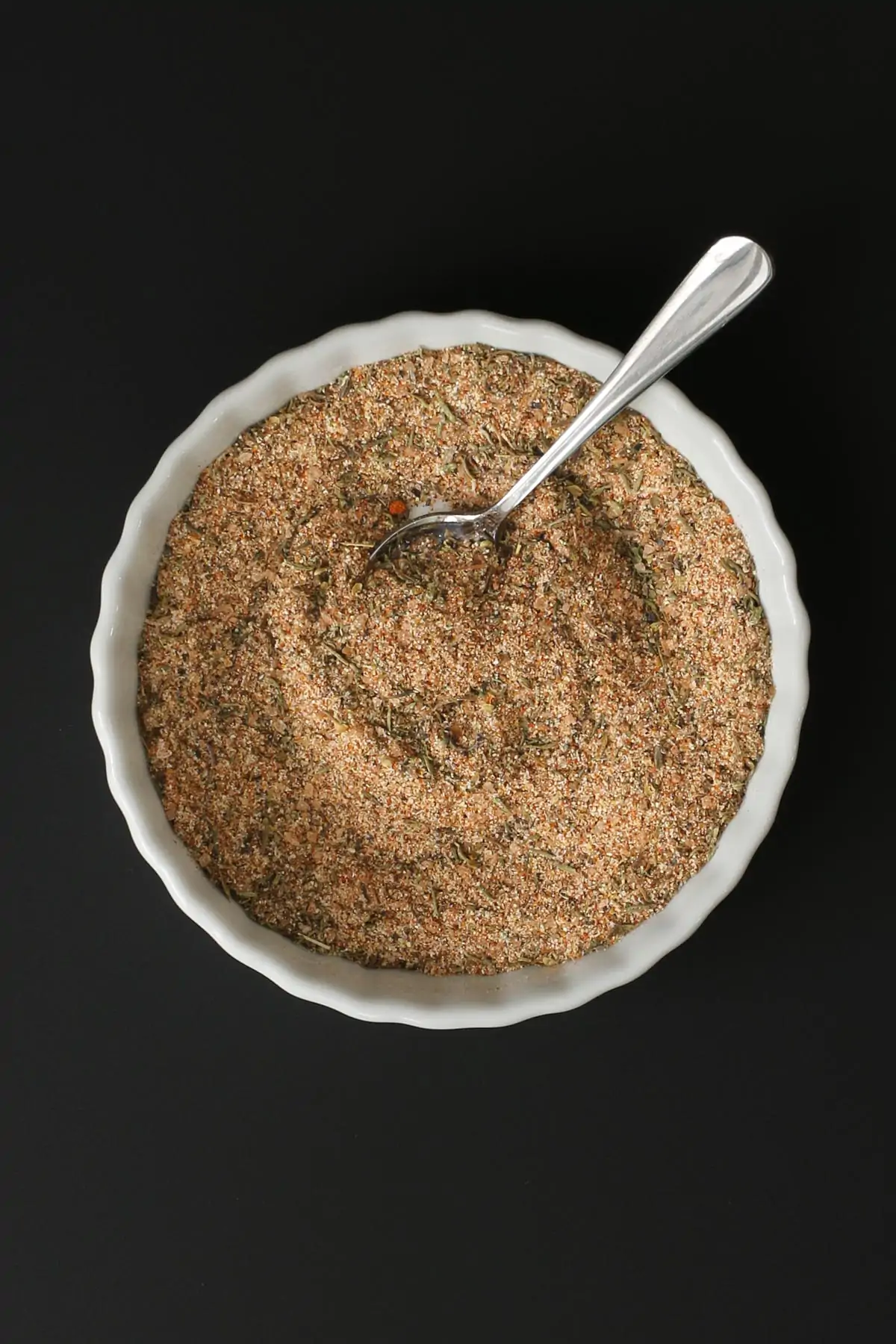 cajun spice blend in a dish with a spoon.