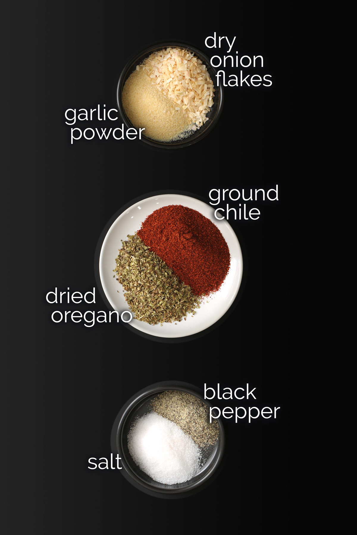 ingredients for taco seasoning recipe laid out on table top.