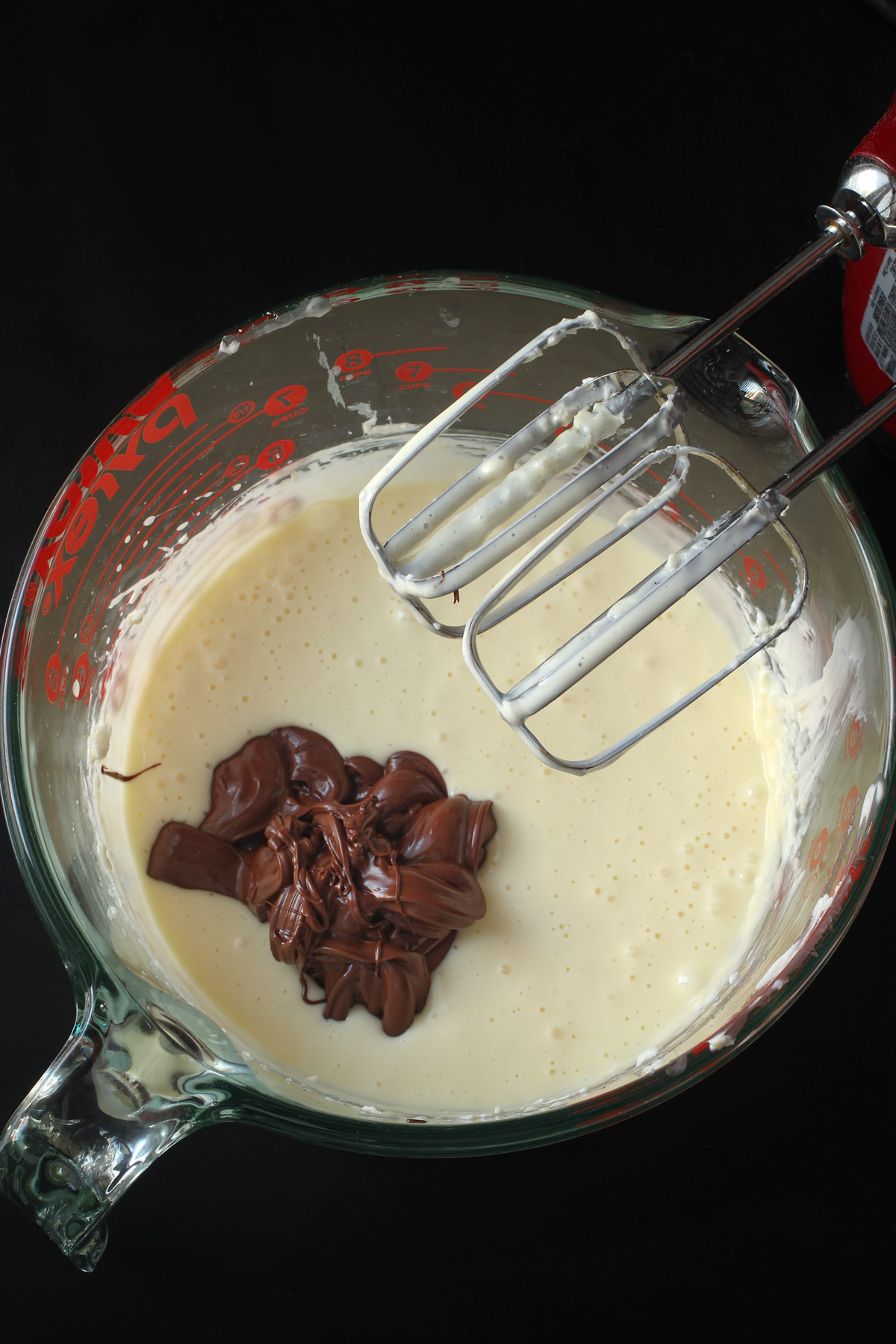 mixing in the melted chocolate into cream cheese mixture.