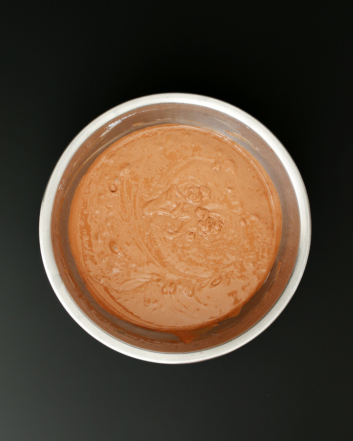 blended cake mix in mixing bowl.