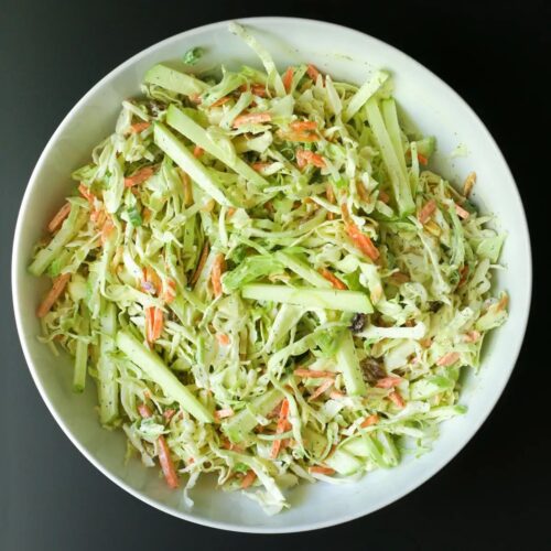 overhead shot of bowl of coleslaw with apples.