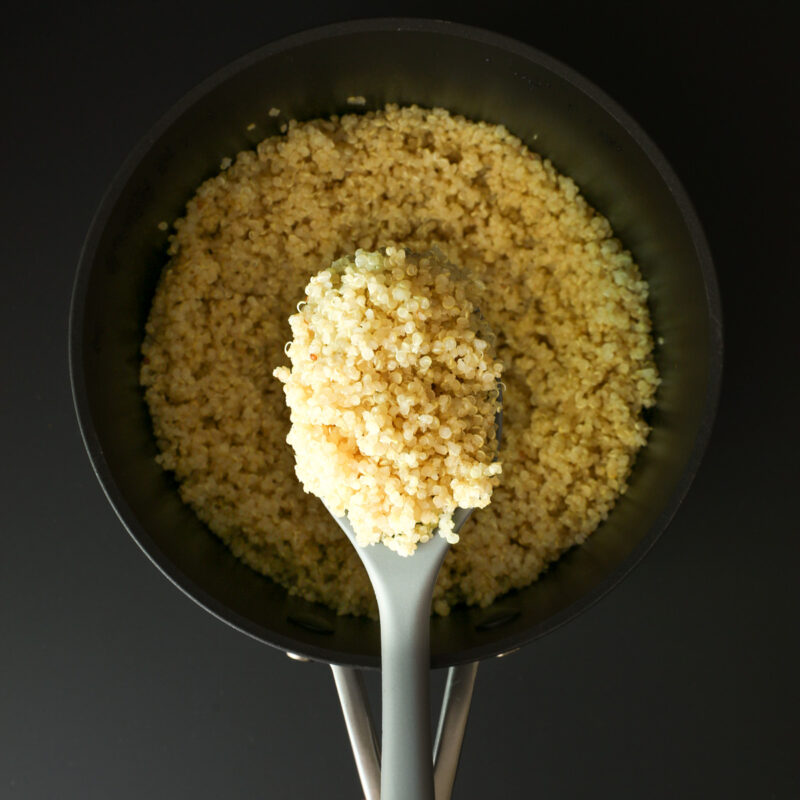 overhead closeup of quinoa cooked on stove.
