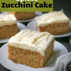 squares of zucchini cake on white plates with text overlay.