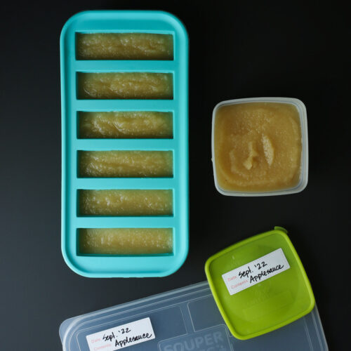 applesauce divided into containers to freeze.