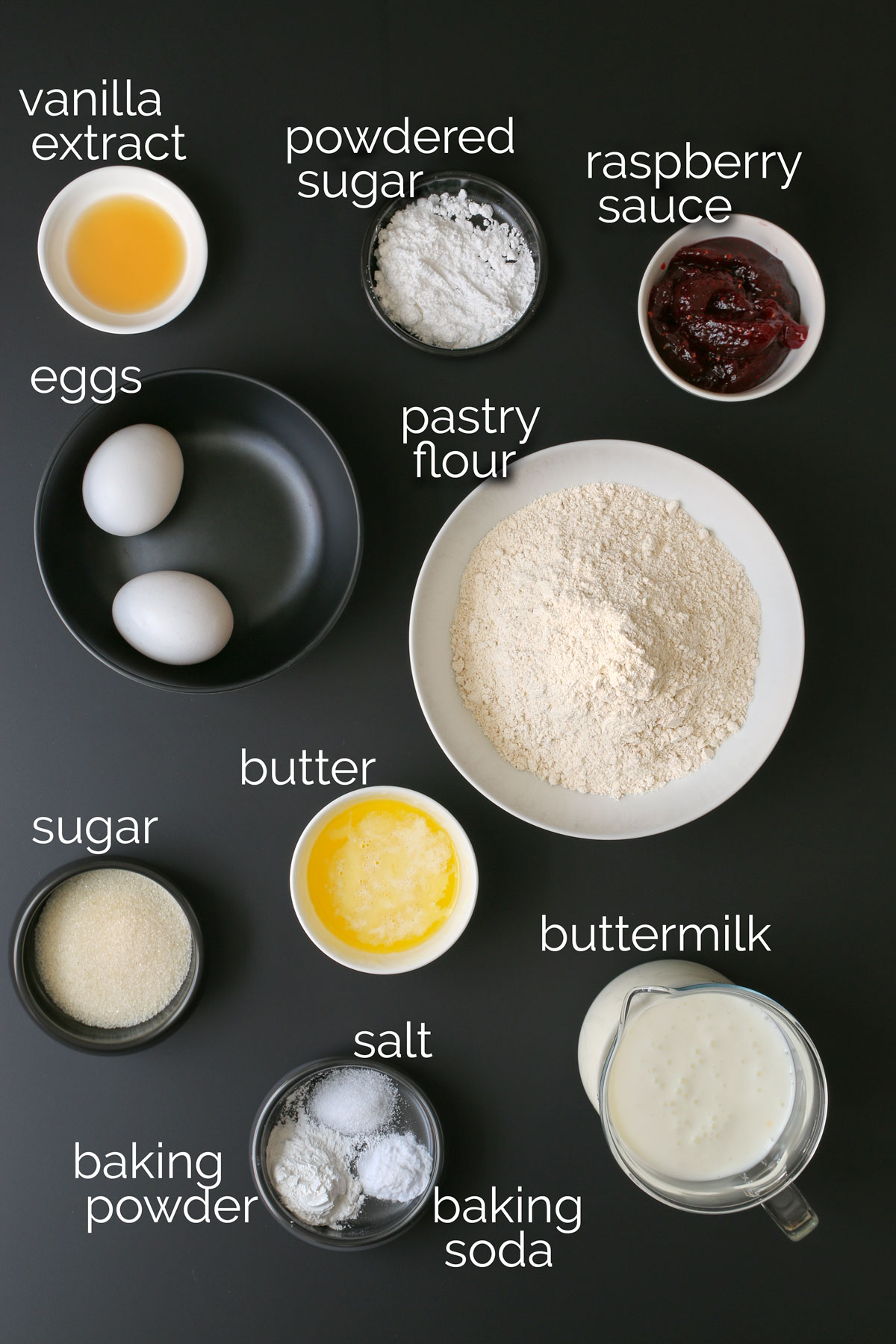 ingredients for aebleskiver laid out on black countertop.