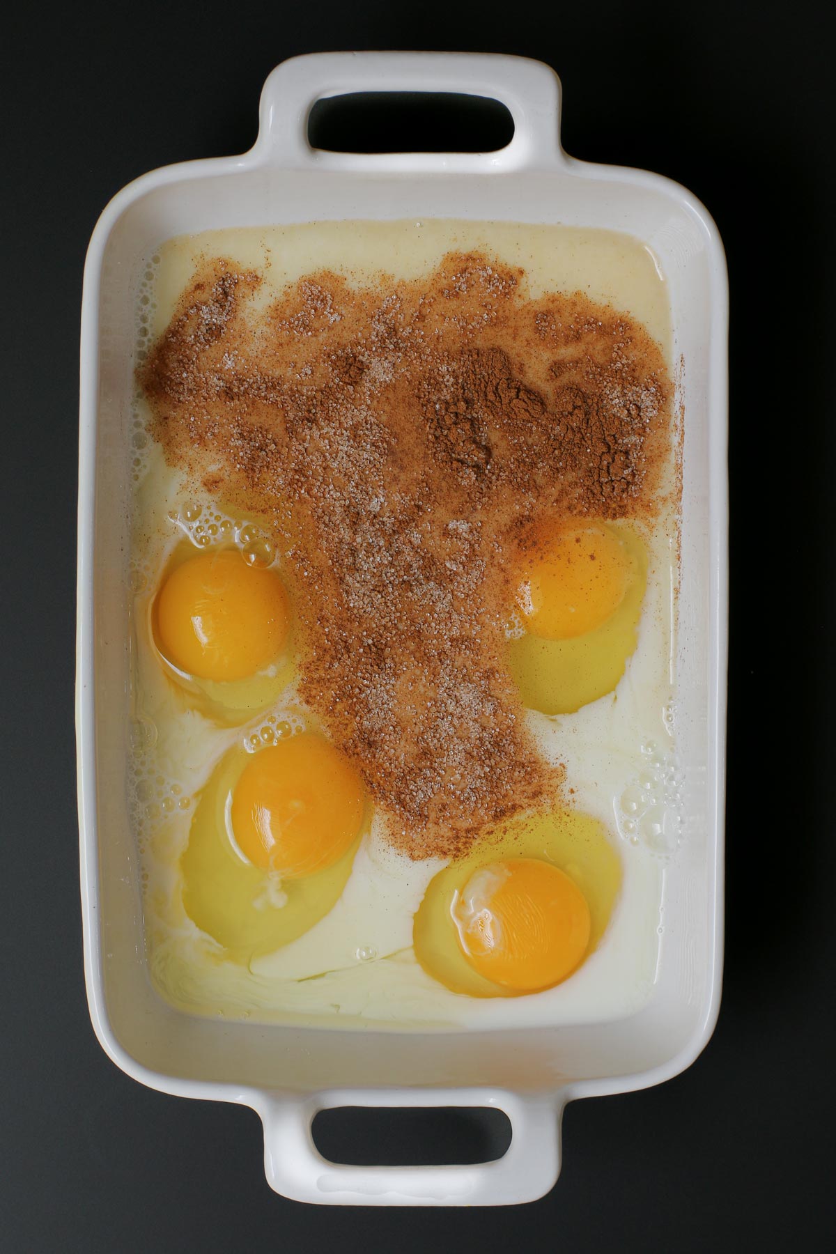 eggs, milk, sugar, and cinnamon in shallow dish.