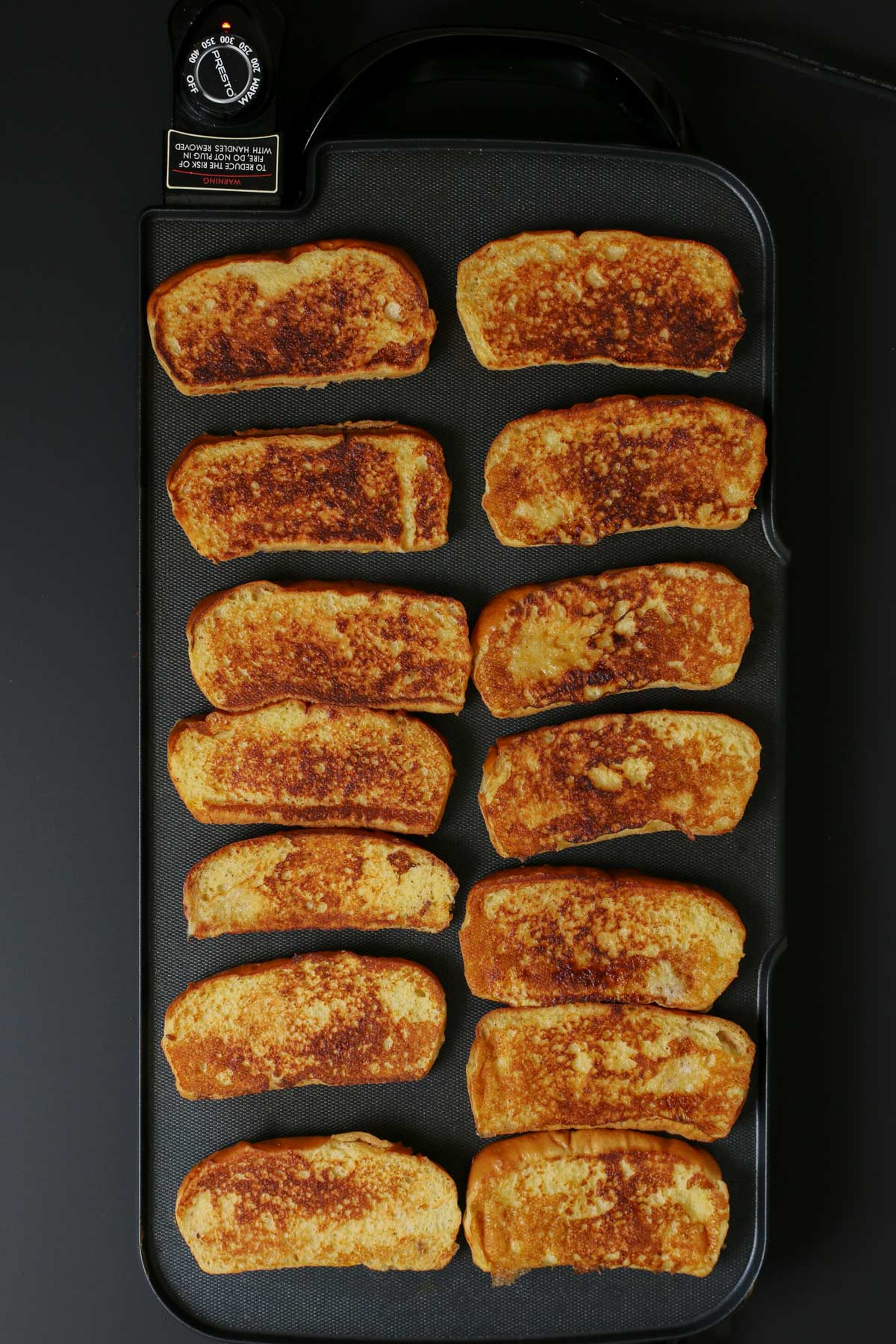 toasted French toast on hot griddle.