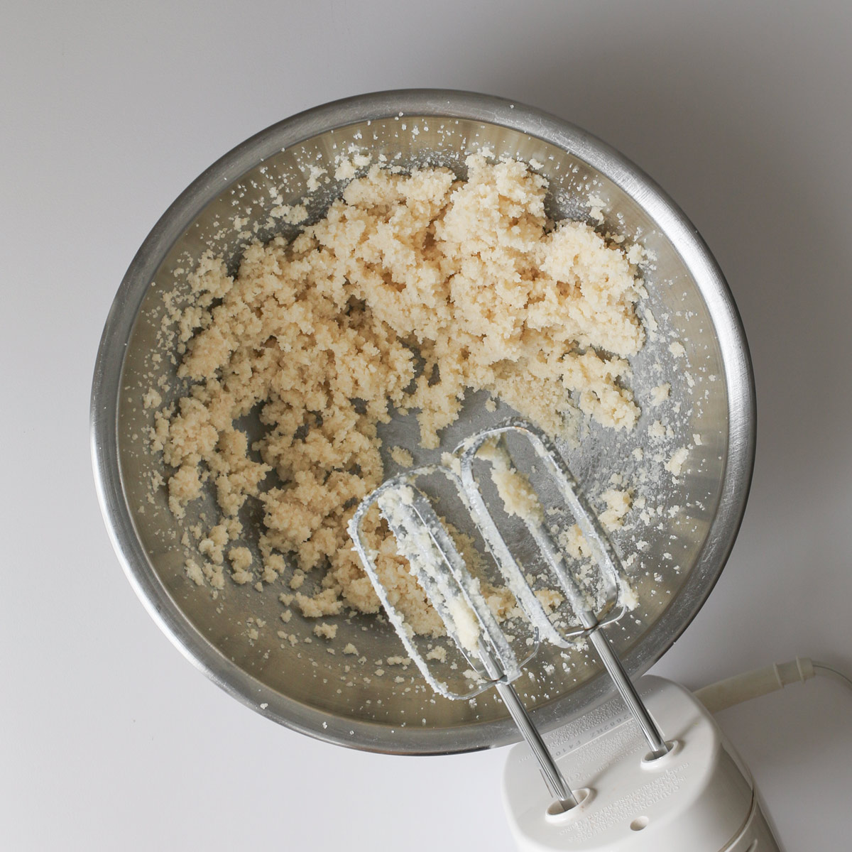 butter and sugar creamed in mixing bowl with hand mixer.