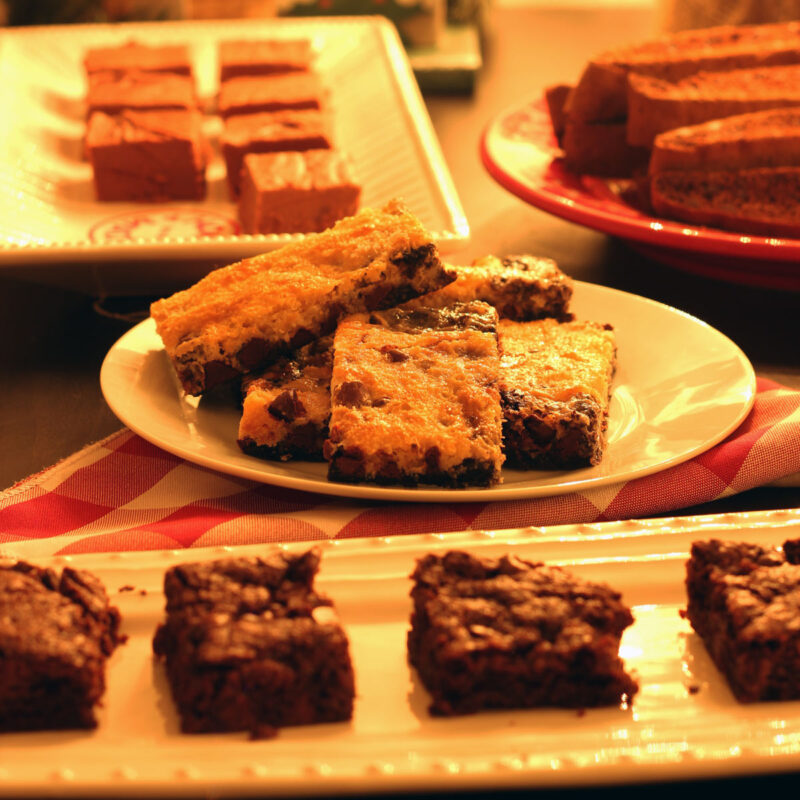 close up of cookie plates on Christmas table.