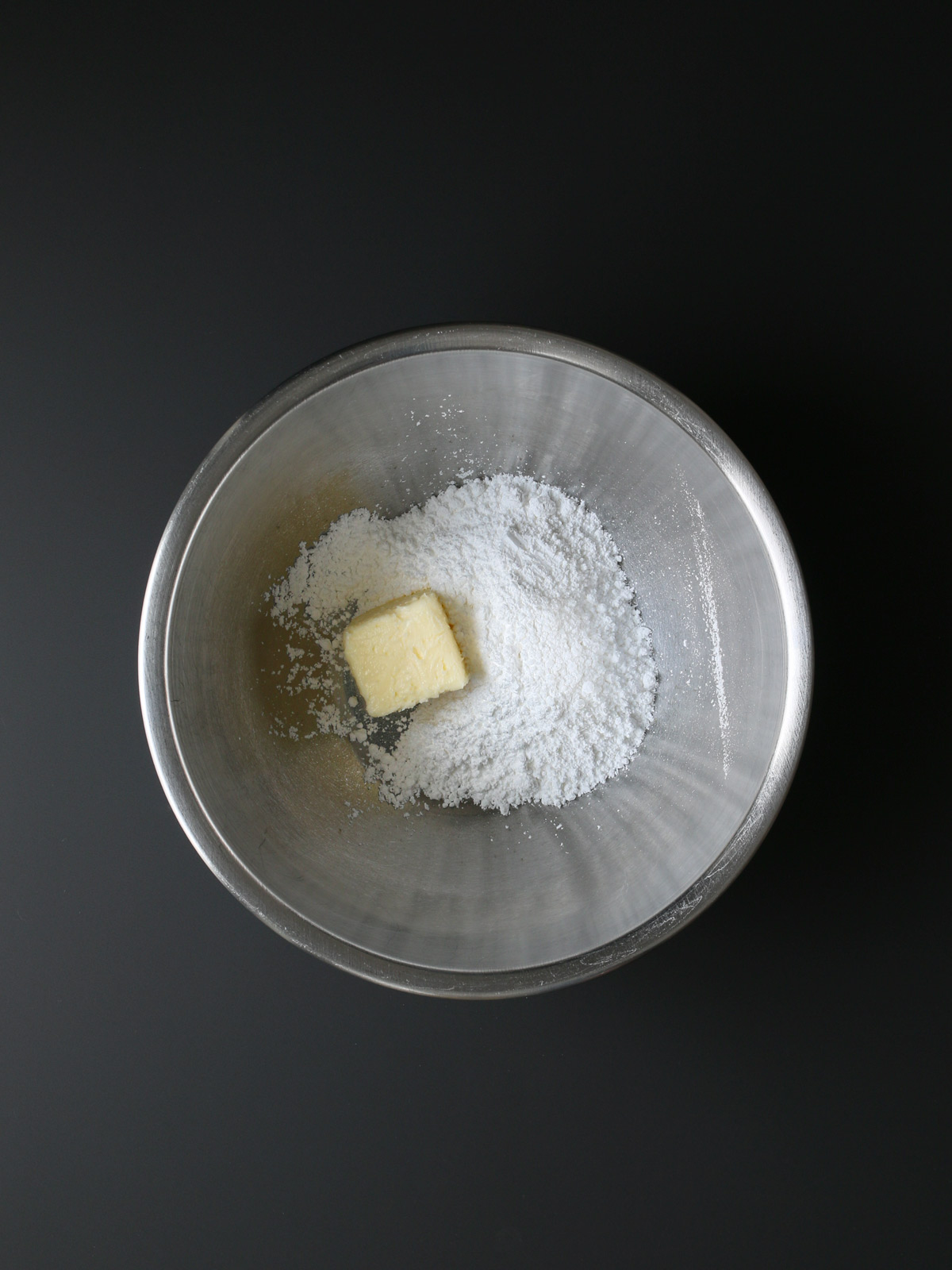 butter and sugar in mixing bowl.