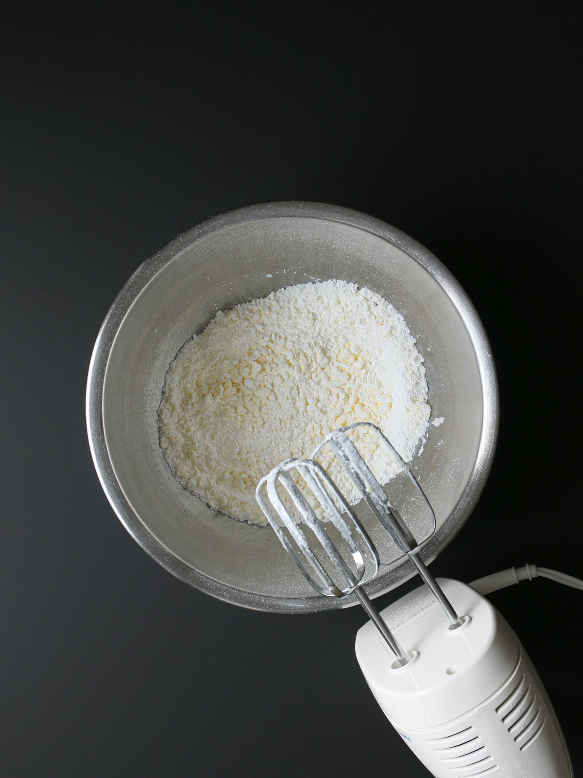 butter creamed into sugar with mixer.