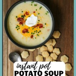 bowl of soup on a board with a spoon and oyster crackers, with text overlay.