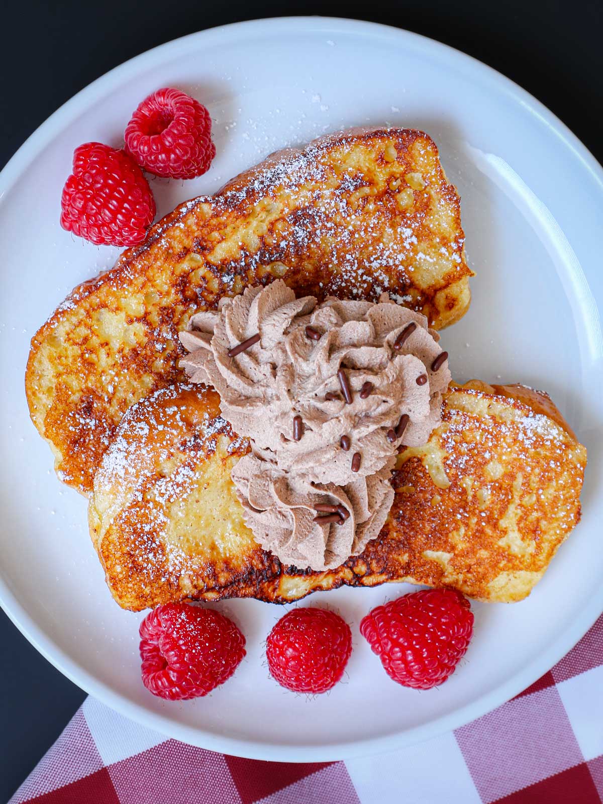 french toast topped with chocolate whipped cream.