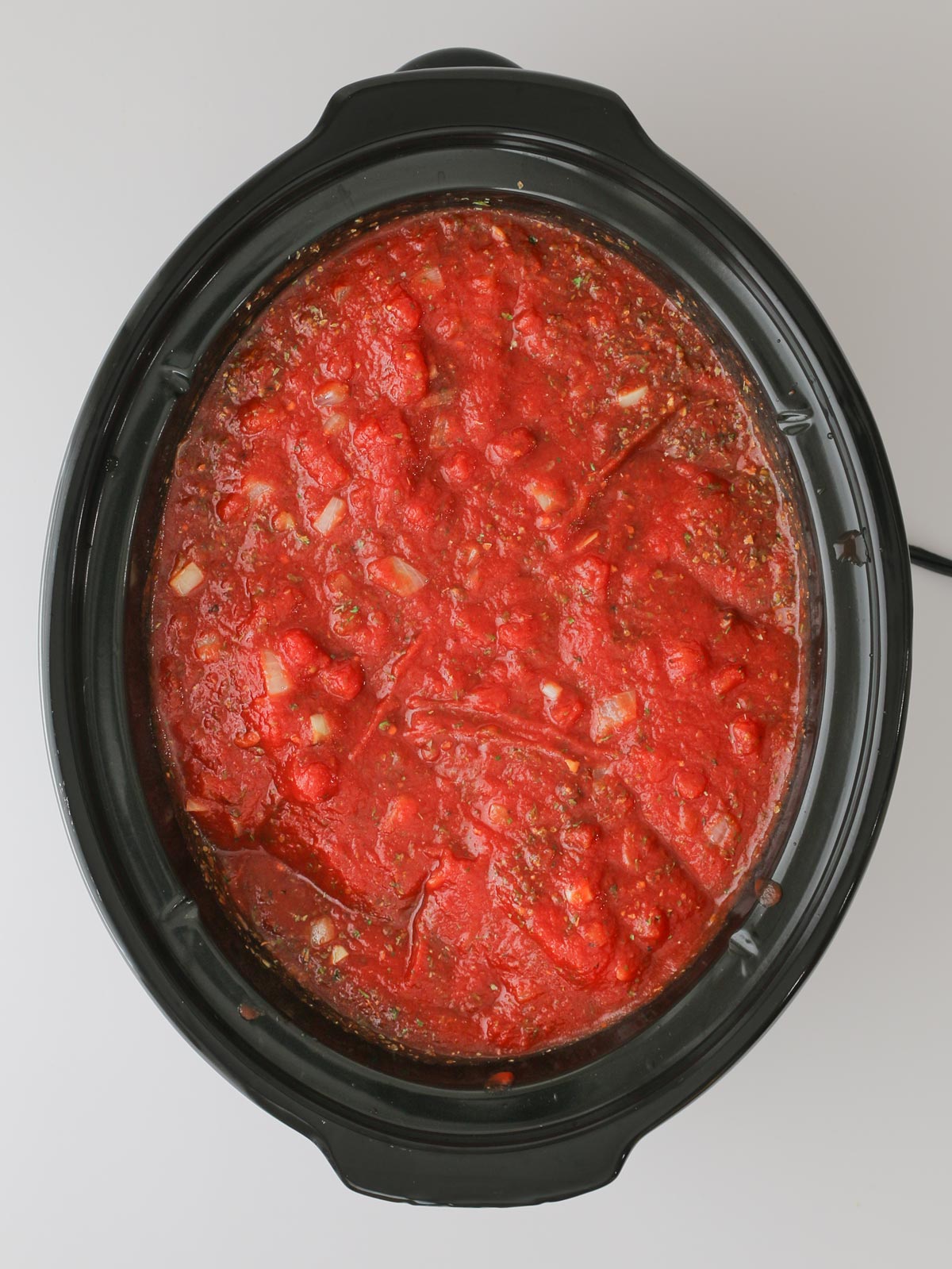 the sauce ready to simmer in the crockpot.