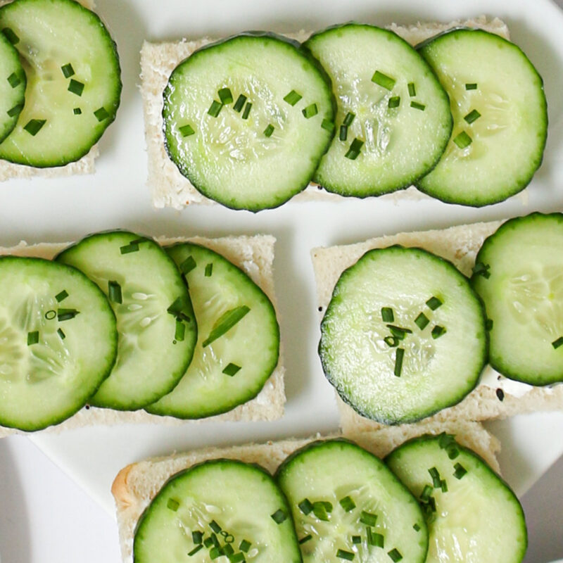 overhead shot of open faced cucumber sandwiches.