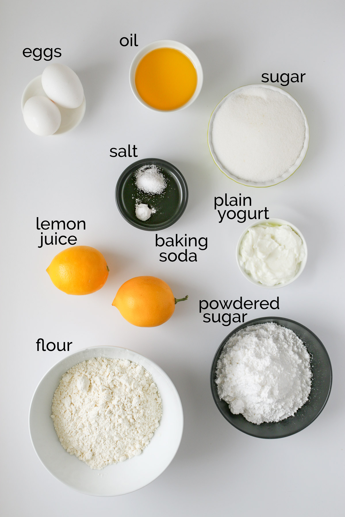 ingredients for lemon loaf laid out on white counter.