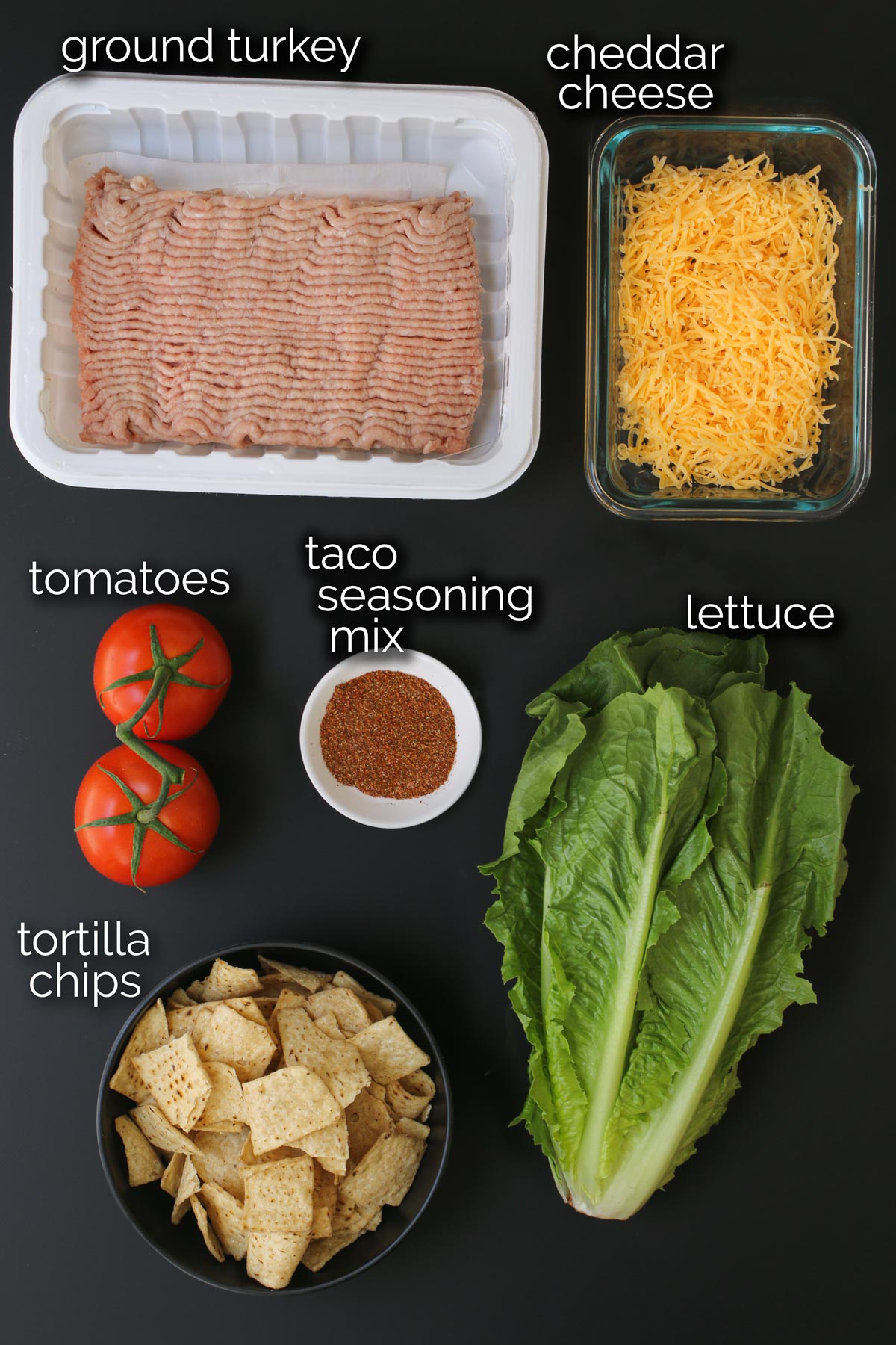 ingredients for taco salad, laid out on a counter.
