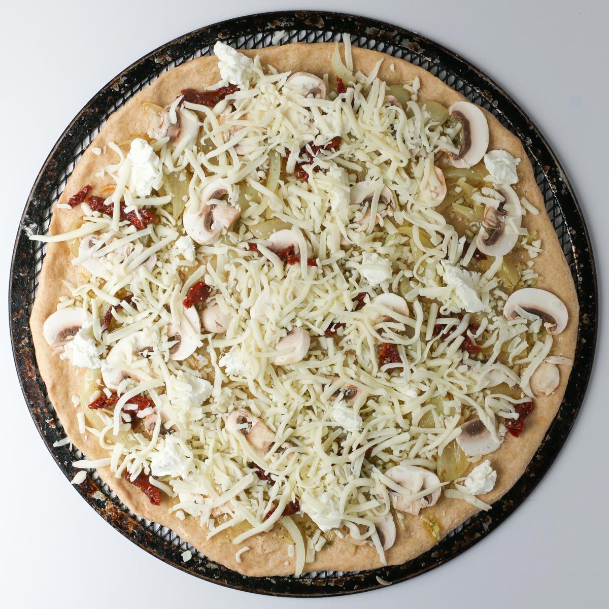 cheeses added to the pizza.