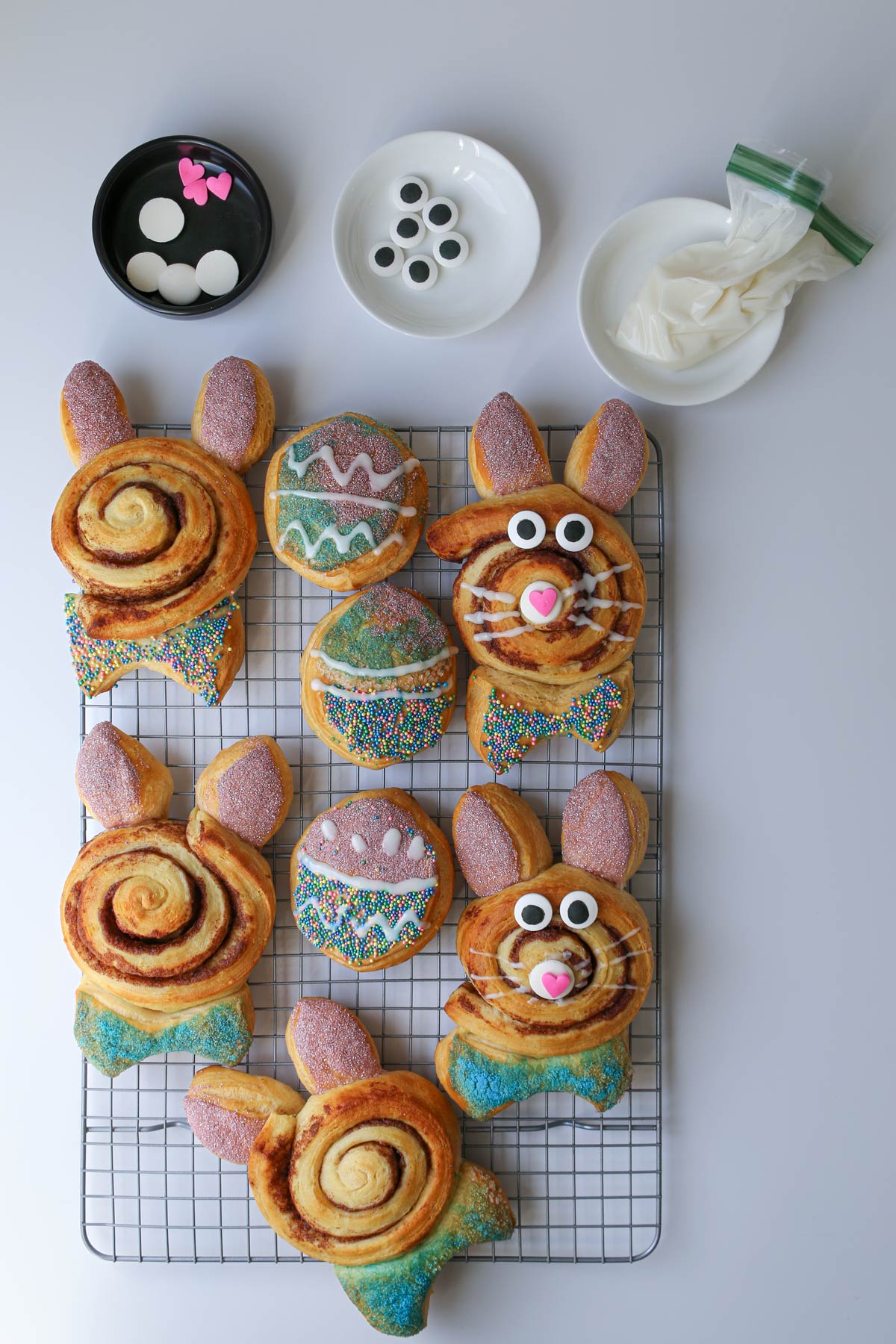adding details with frosting and candy to bunnies and eggs.