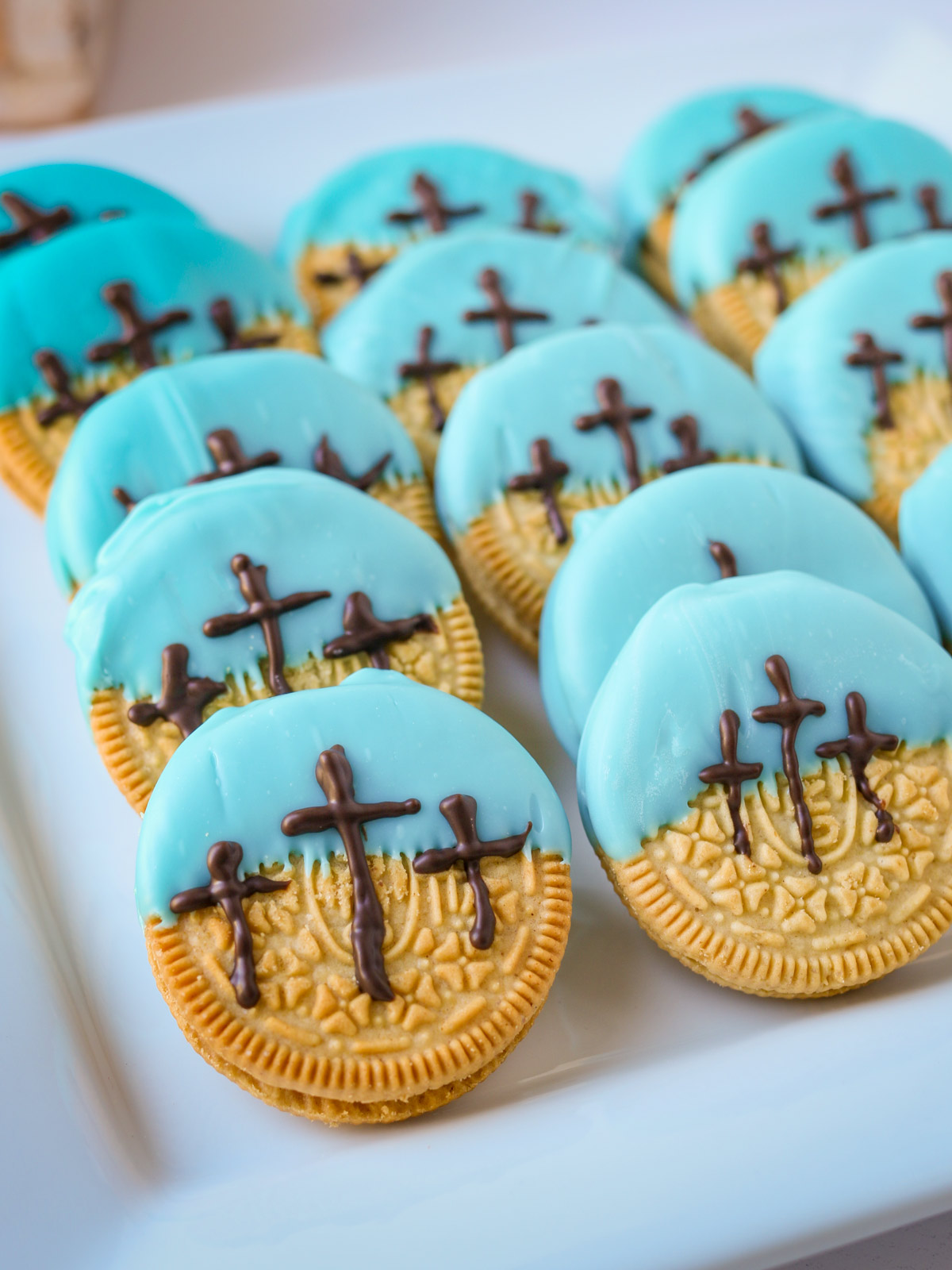 easter cross oreos lined up on a white dish.
